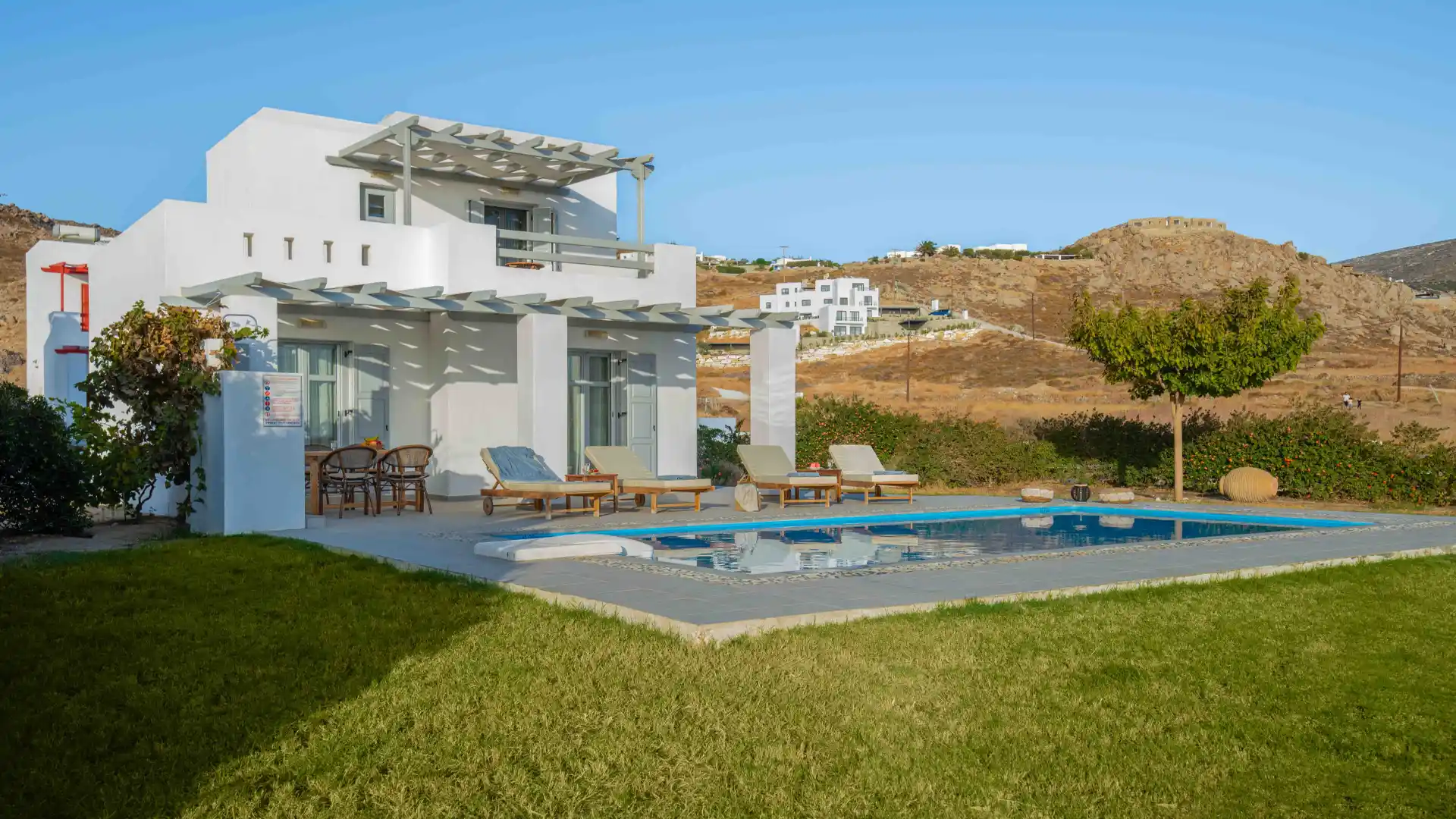 Luxury villa heron behind its garden in Natura villas in Naxos