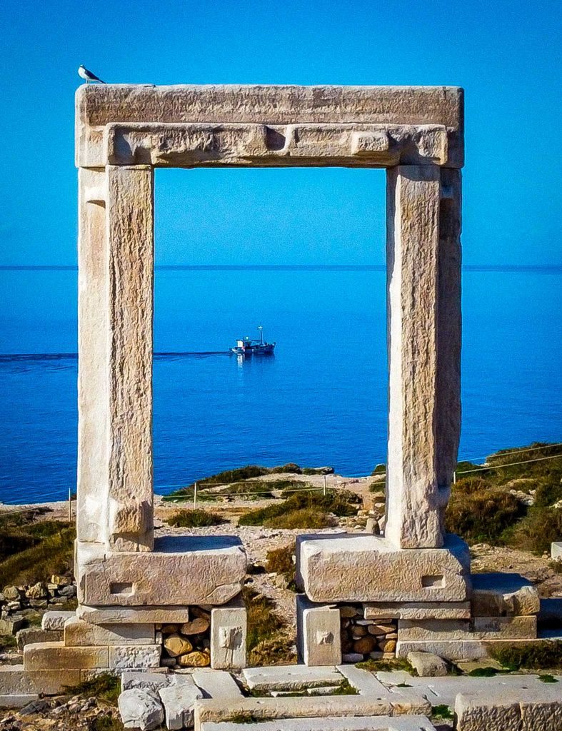 Apollos temple in naxos, front view with boat in the background